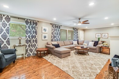 Living room with refinished wood floors.