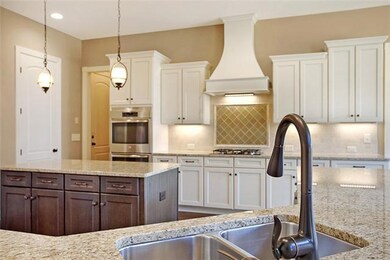 Gorgeous Granite & Tiled Backsplash Perfectly Accent this Stunning Gourmet Kitchen. ALL PHOTOS OF SIMILAR HOME & FOR REPRESENTATION ONLY- HOME IS UNDER CONSTRUCTION.