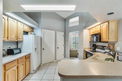 Kitchen includes a breakfast bar and pantry