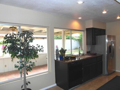 Kitchen View To Arizona Room & Back Yard