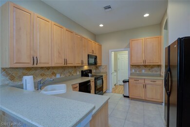 Corian breakfast bar / countertops with custom til