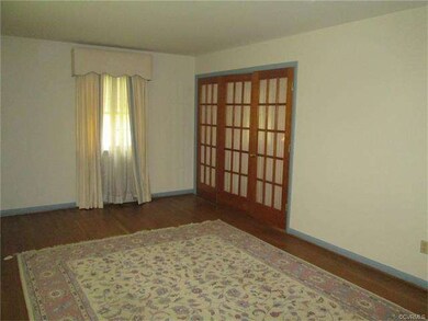 Formal living room with French doors that opens to