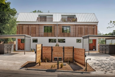 Rear view of property with a standing seam roof, 