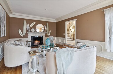 Spacious living room featuring a cozy fireplace, p