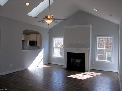 The large great room has a dramatic cathedral ceiling, gorgeous 5