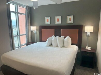 Bedroom with multiple windows
