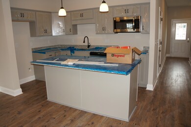 Large Kitchen Island with accommodate 3-4 counter height stools.