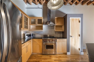 Kitchen featuring appliances with stainless steel
