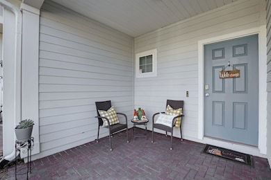Doorway to property with a patio area