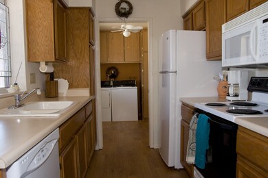 Galley kitchen, honey oak cabinets.