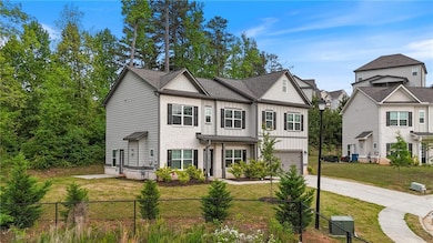 Traditional home with a garage, concrete driveway,