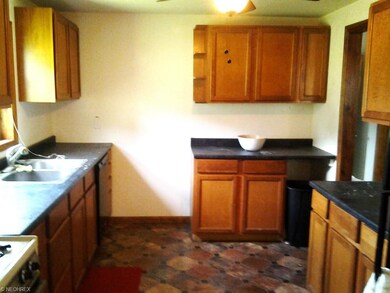 Freshly painted Kitchen with lots of cabinetry, vi