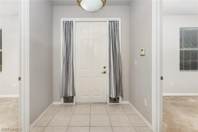 Front door and foyer with den on left and guest be