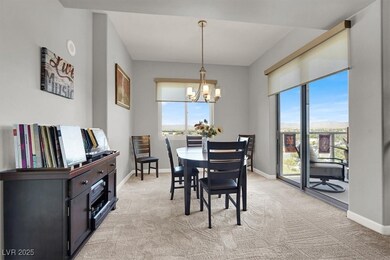 Dining space featuring light colored carpet and a