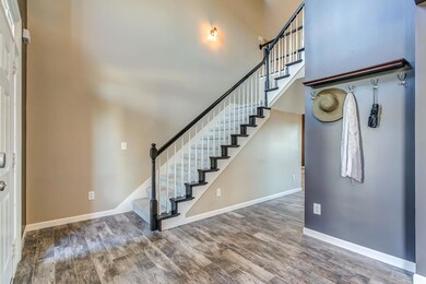 This wall going up the stairs is the perfect place for your favorite photos, or artwork!