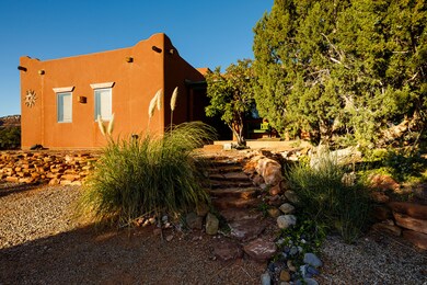 View of side of home featuring stucco siding