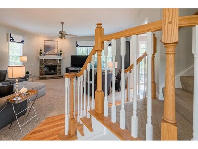Family room with handsome stone fireplace.