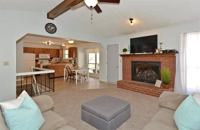 Vaulted Greatroom with Brick Woodburning Fireplace