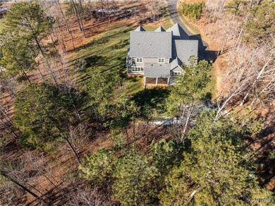 View of house from the back with wooded private ya