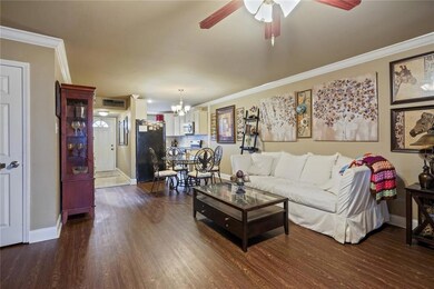 View from den to foyer, half bath off of foyer.
