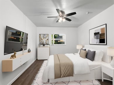 Bedroom featuring wood finished floors and a ceiling fan