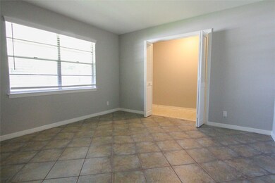 Located at the front of the home is the Study. Features include double doors, tile flooring and large windows.