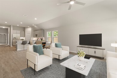 Gather the family and guests together in your lovely living room! Featuring high ceilings, recessed lighting, dark stained ceiling fan, custom paint, gorgeous floors, and large windows that provide plenty of natural lighting throughout the day.
