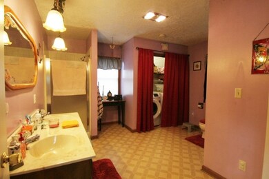 Main Bath is over sized and houses washer and drye