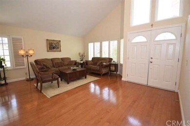 Large living room with high vaulted ceilings, wood