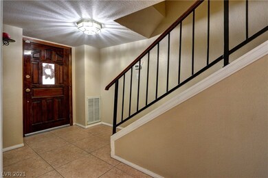 Entry wood door and iron stair railing