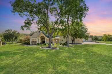 The magnificent oak trees, spacious front yard, and walkway to the long front porch provide wonderful curb appeal.