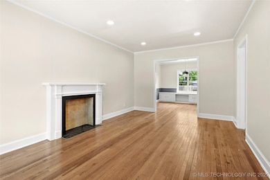 Unfurnished living room with light wood-type floor