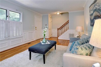 Guests are welcomed into the gracious living room.