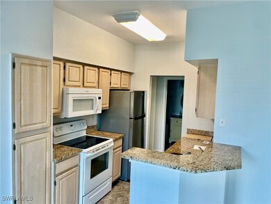 Kitchen featuring light brown cabinetry, kitchen p