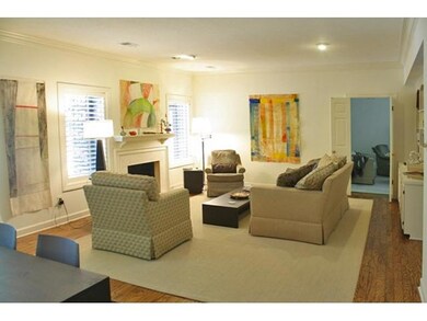 Open large living room has built in bookshelves (n