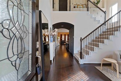 Elegant glass door welcomes you into this warm and