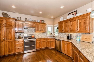 Updated backsplash, granite counters and gas range