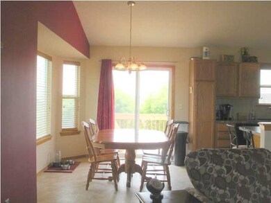 Dining Room with large windows next to Kitchen