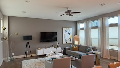 Virtual Staging Living room:illed with sunlight from plenty of windows, this inviting space features warm wood floors that balance contemporary style with comfort, offering an ideal setting for everyday living or relaxed entertaining.