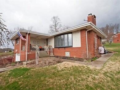 Relax on front porch or access the rear patio on c
