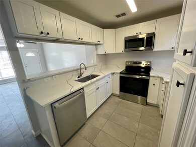 Kitchen featuring appliances with stainless steel 
