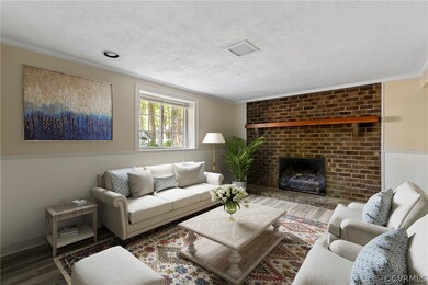 Virtually staged. Living room with hardwood / wood