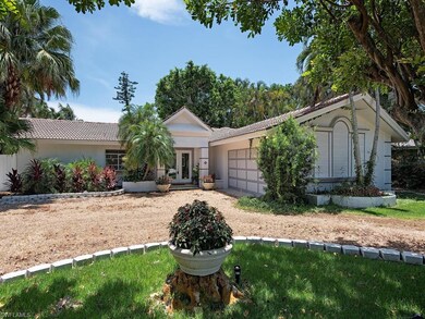 Circular driveway leads to front of home with 2-ca