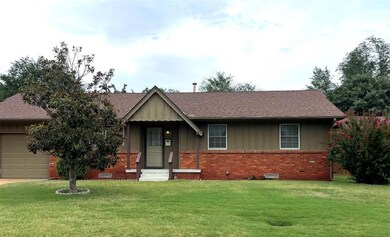 View of front of home featuring a garage and a fro