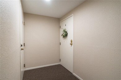 Hallway and entrance to Condominium A.  Laundry Ro