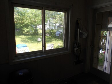 Kitchen window looking to back yard