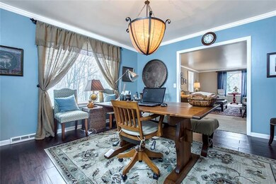 Dining Room with Hardwood Flooring, Crown Molding 