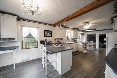 Large eat in kitchen has plenty of cooking and ent