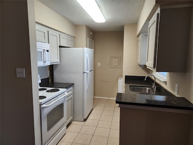 Kitchen with quartz countertops and custom cabinet