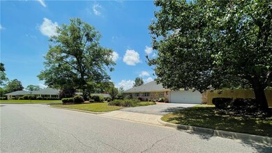 Obstructed view of property with a garage, fence, 